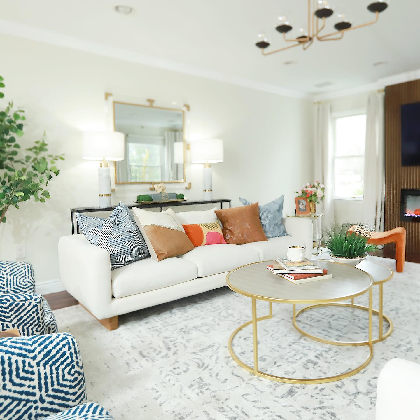 4. Cozy Nook with a Turquoise Accent Wall and Mosaic Fireplace Surround