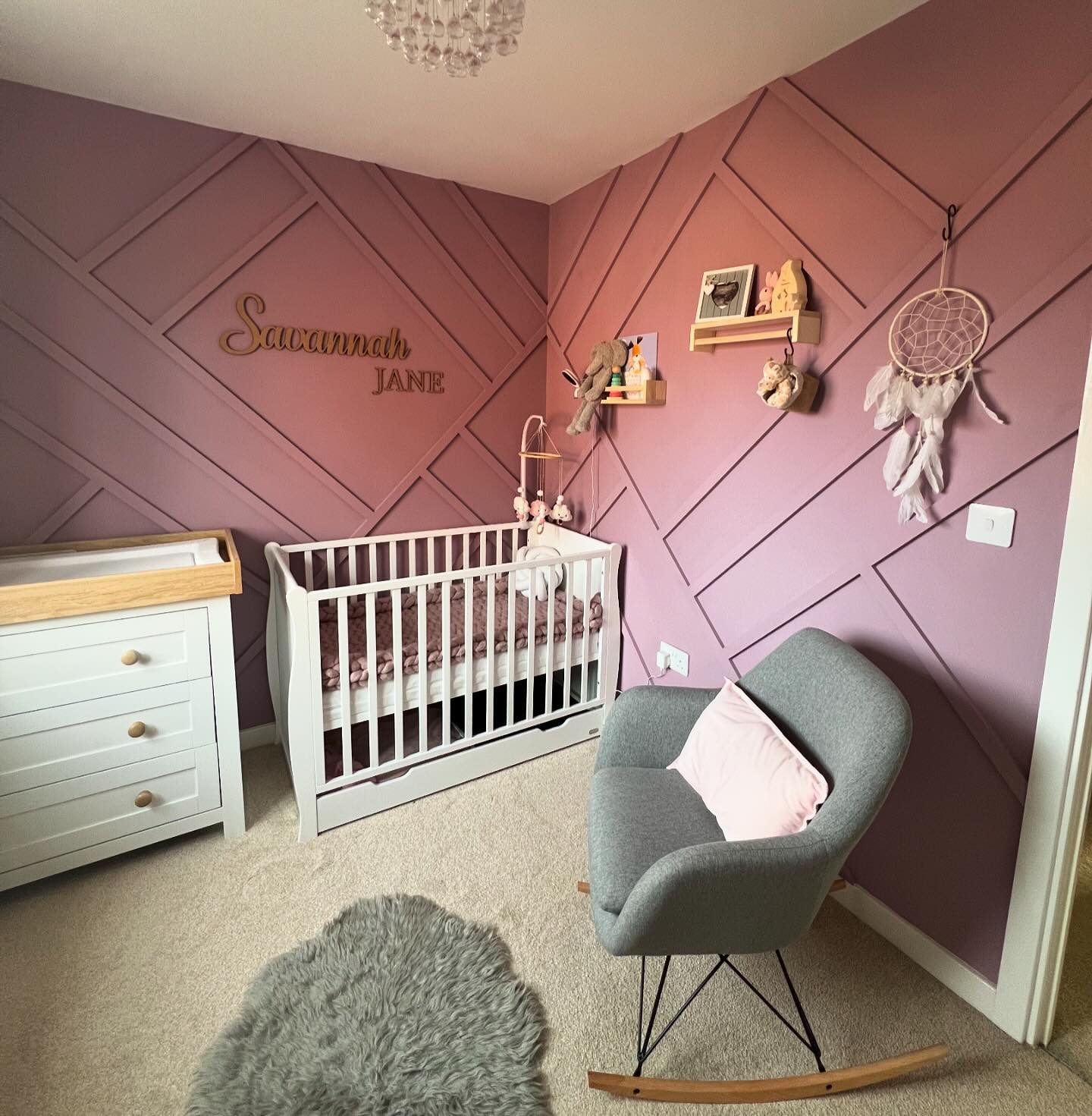 10. Soft Lavender Clouds and Whimsical Owls Adorn a Tranquil Girl's Nursery