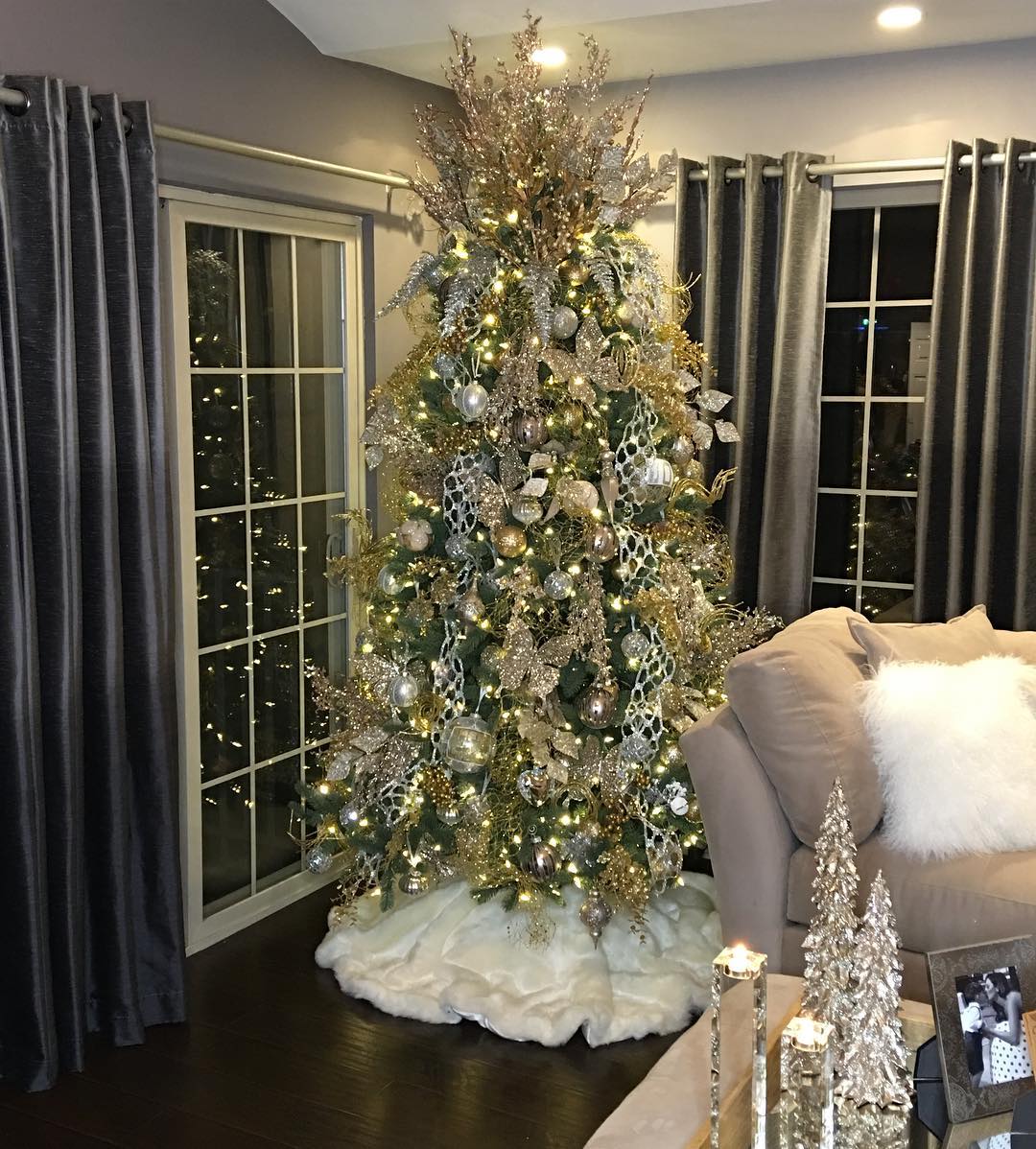 11. Silver Ribboned Pinecone Garland Woven Through a Rustic Ladder