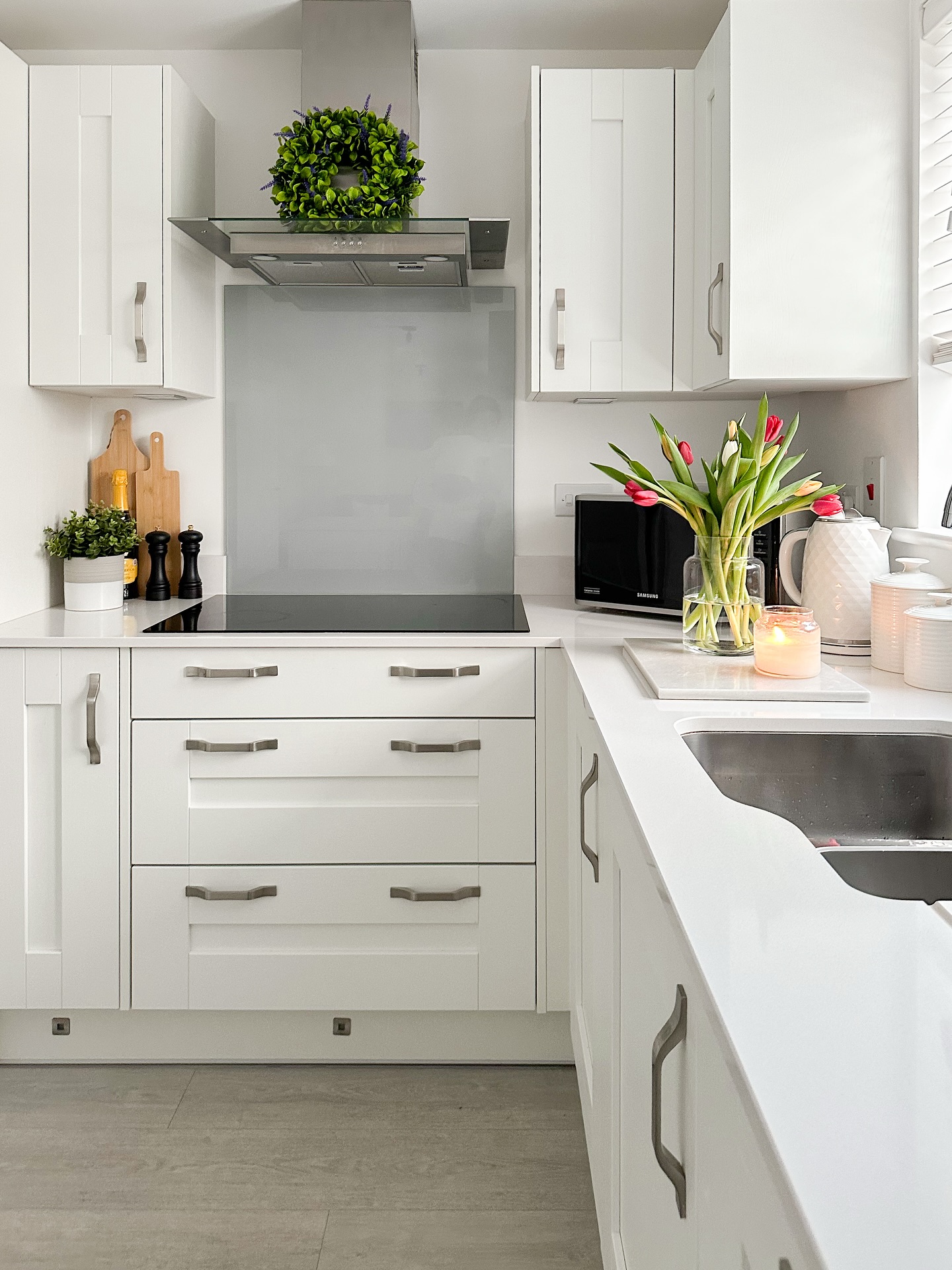 13. White Cabinets with Midnight Blue Island and Gold Accents Create a Regal Contrast