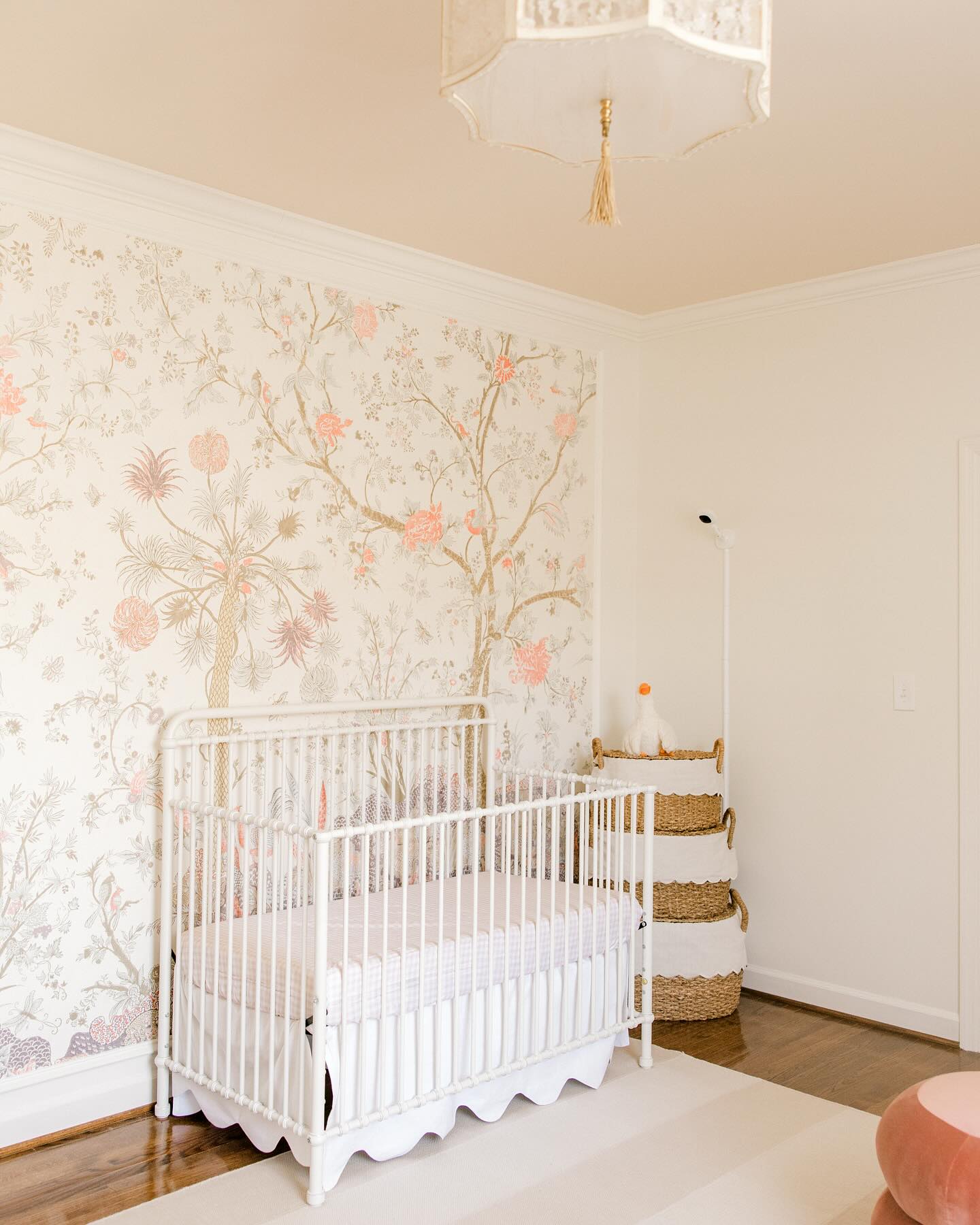 31. Soft Blush Tulle Canopy Over Vintage White Crib In a Sunlit Corner