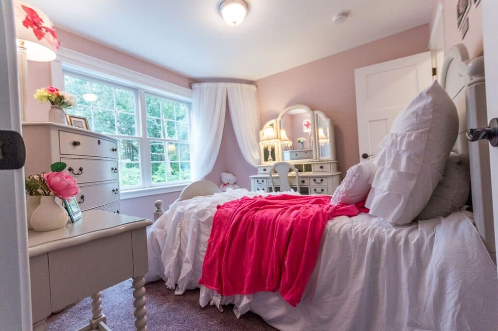 49. Pink Velvet Dreams: a Canopy Bed with Crystal Chandelier Accents