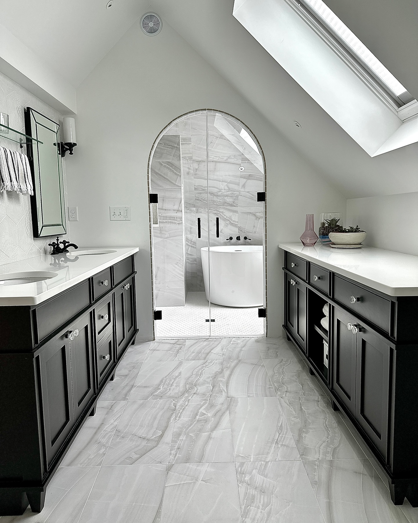 2. Monochrome Mosaic Marvel with Circular Sink and Vintage Mirror