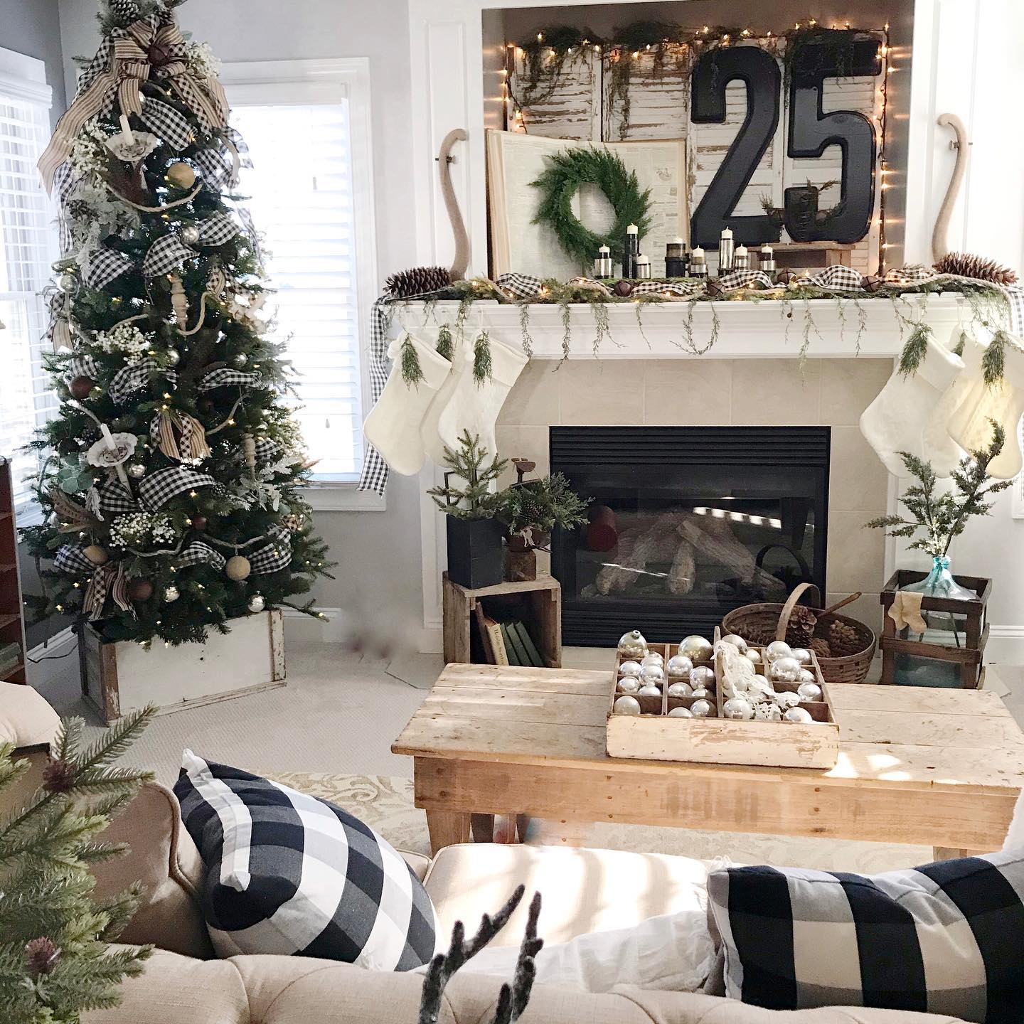 23. Frosted Pinecones and Ribbon-wrapped Ornaments Adorning a Monochrome Tree