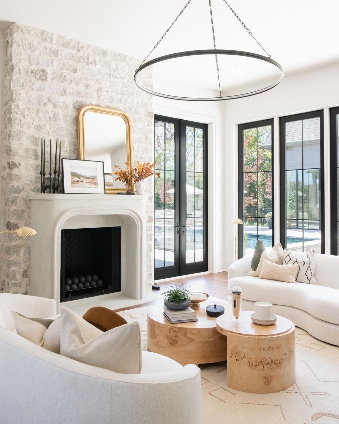 21. the Interwoven Wicker and Olive Branch Coffee Table In a Sunlit Living Room