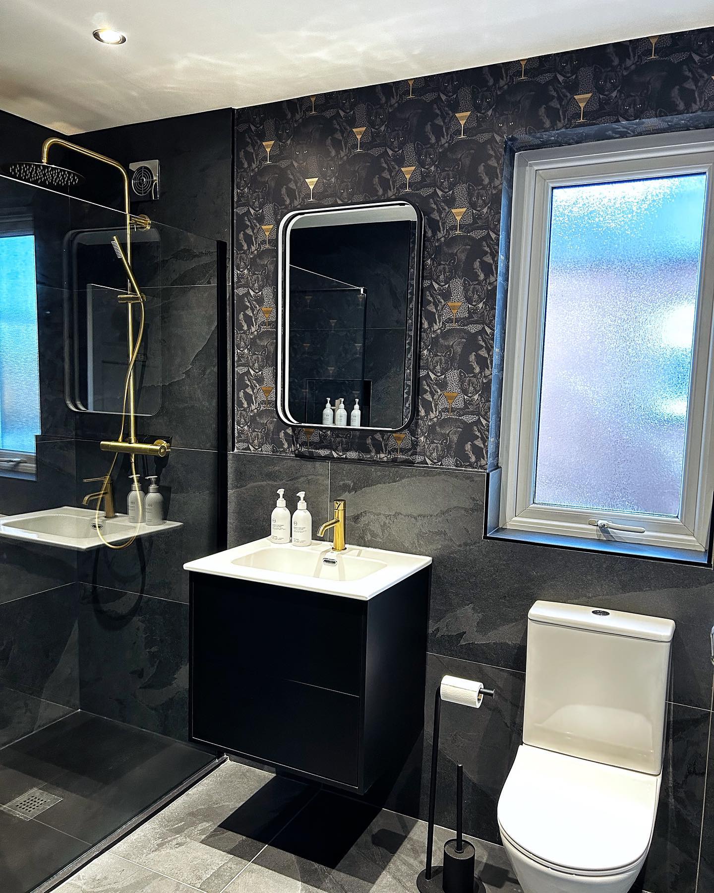 23. the Monochrome Mosaic: a Symphony Of Hexagonal Tiles and Rounded Sinks