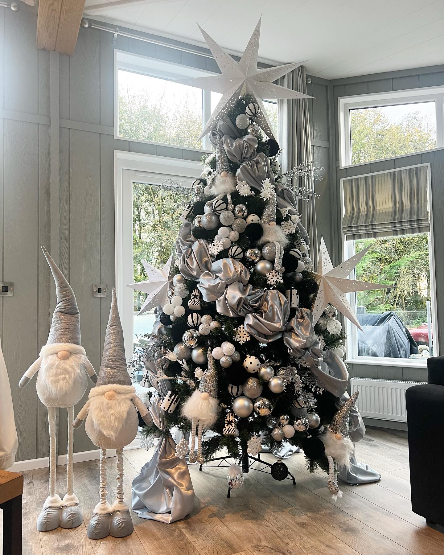 1. Snowflake-kissed Pinecones and Ribboned Ornaments on a Mantelpiece