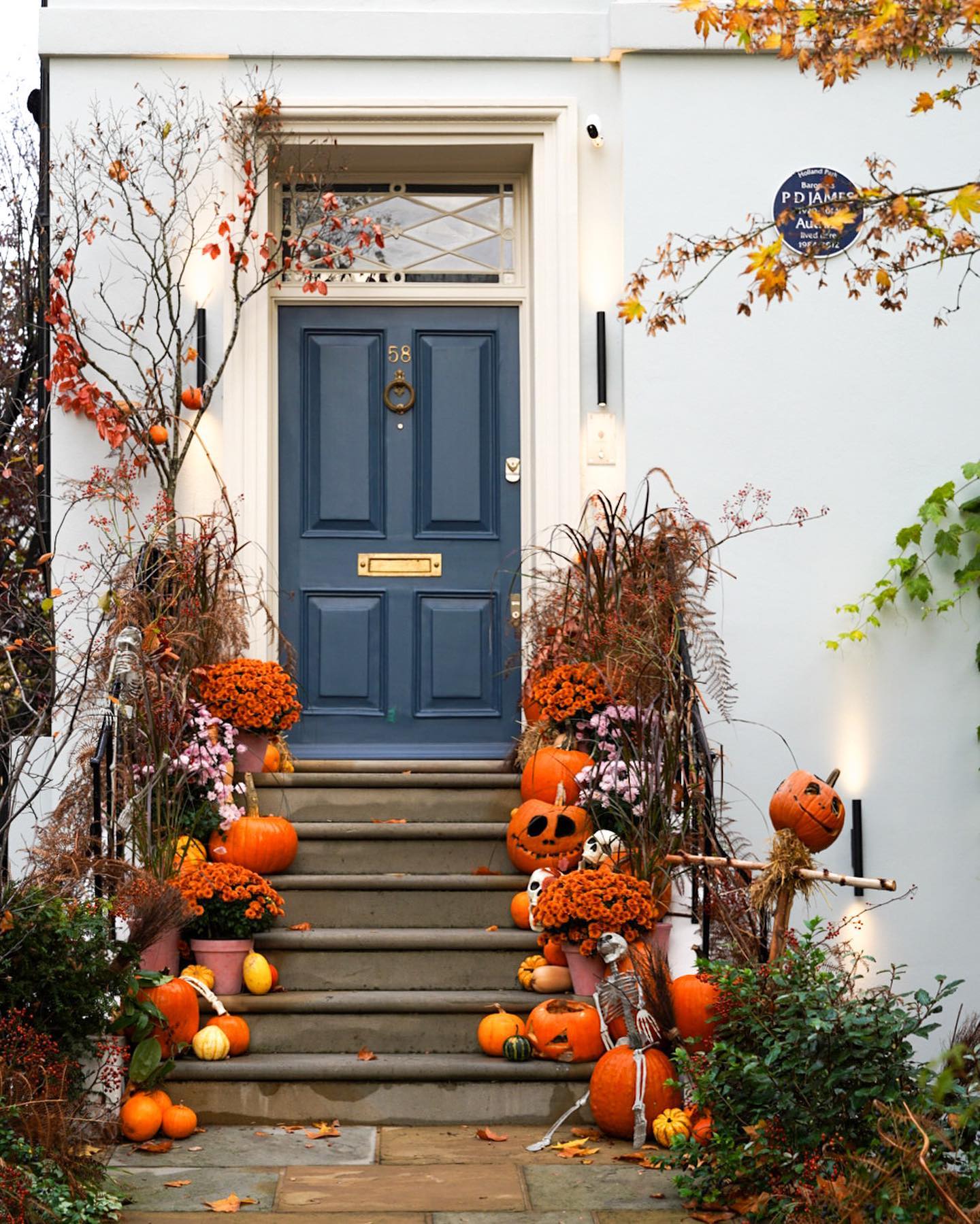 21. Spooky Spider Web with Crawling Arachnids and Glowing Eyes Door Wreath