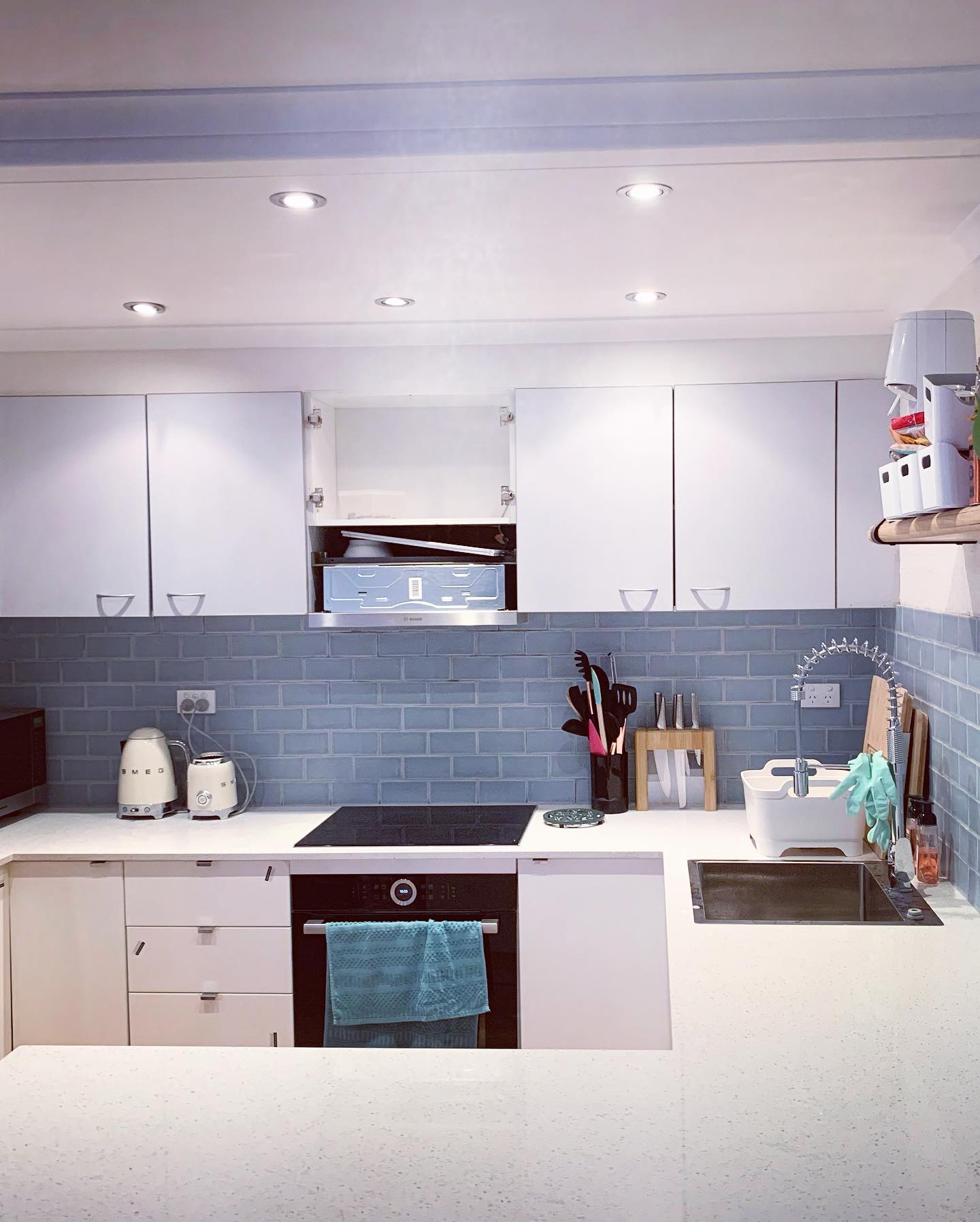 48. Moonlit Marble Mosaic: a Kitchen Backsplash with Crushed Glass Accents