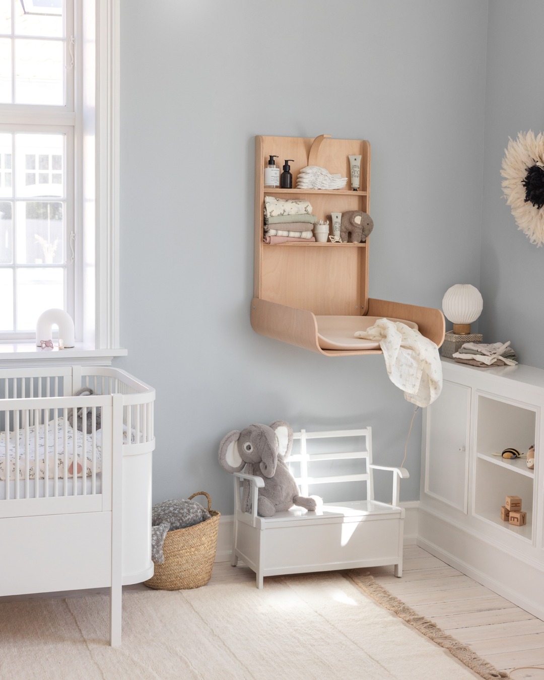 16. Moonlit Lullaby: Soft Grey Clouds and Starry Accents In a Minimalist Nursery