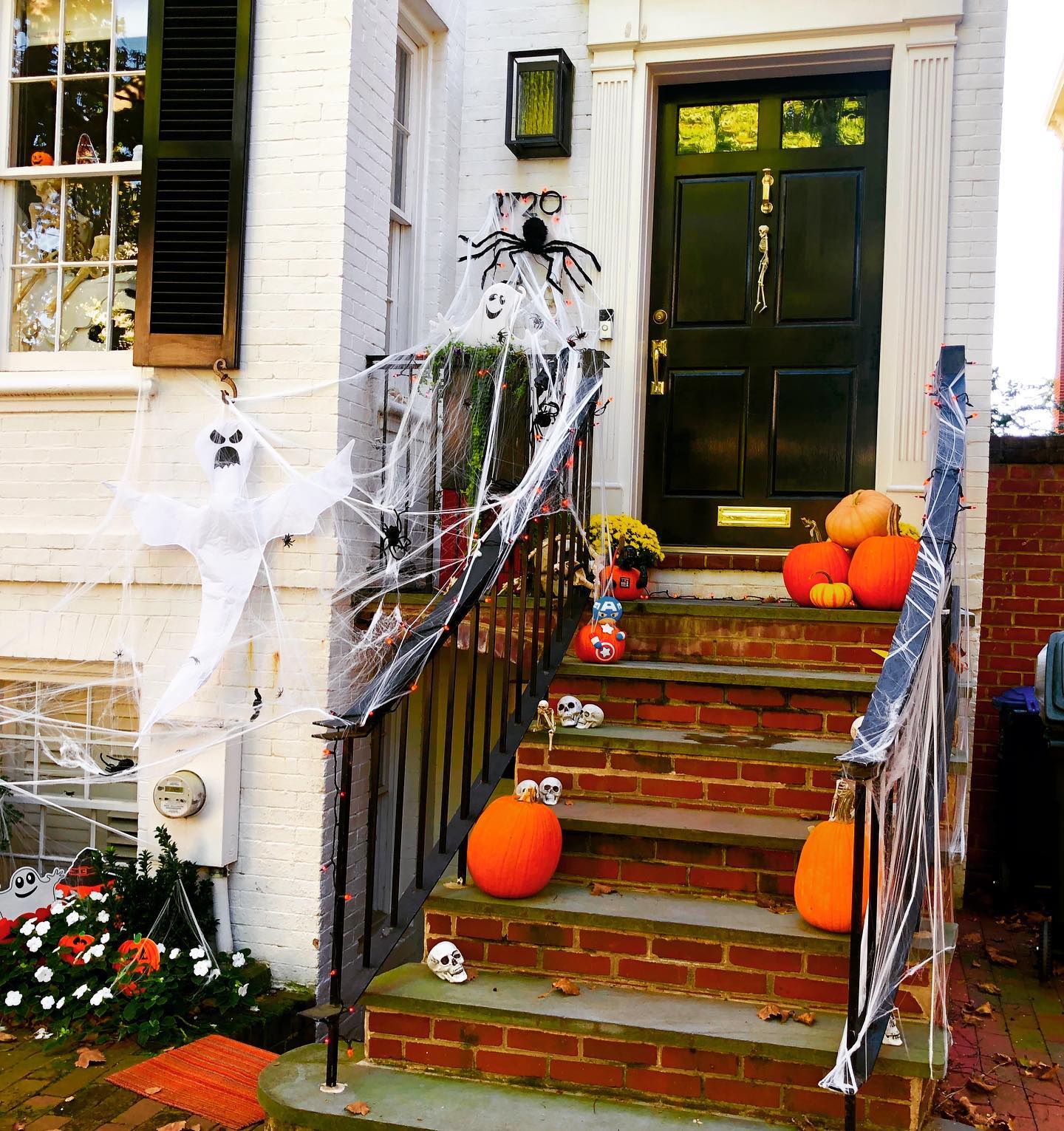 3. Spooky Cobweb Wreath with a Dangling Skeleton Key and Bat Silhouette