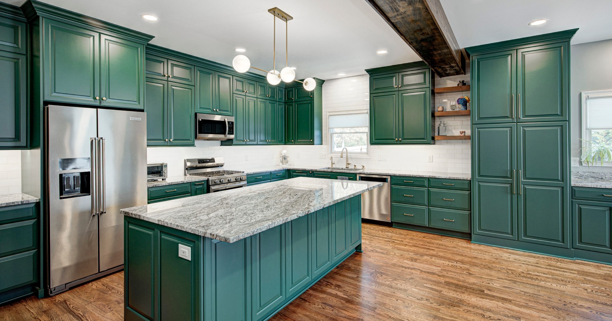 31. Vibrant Emerald Shaker Cabinets with Gold Accents and Open Shelving