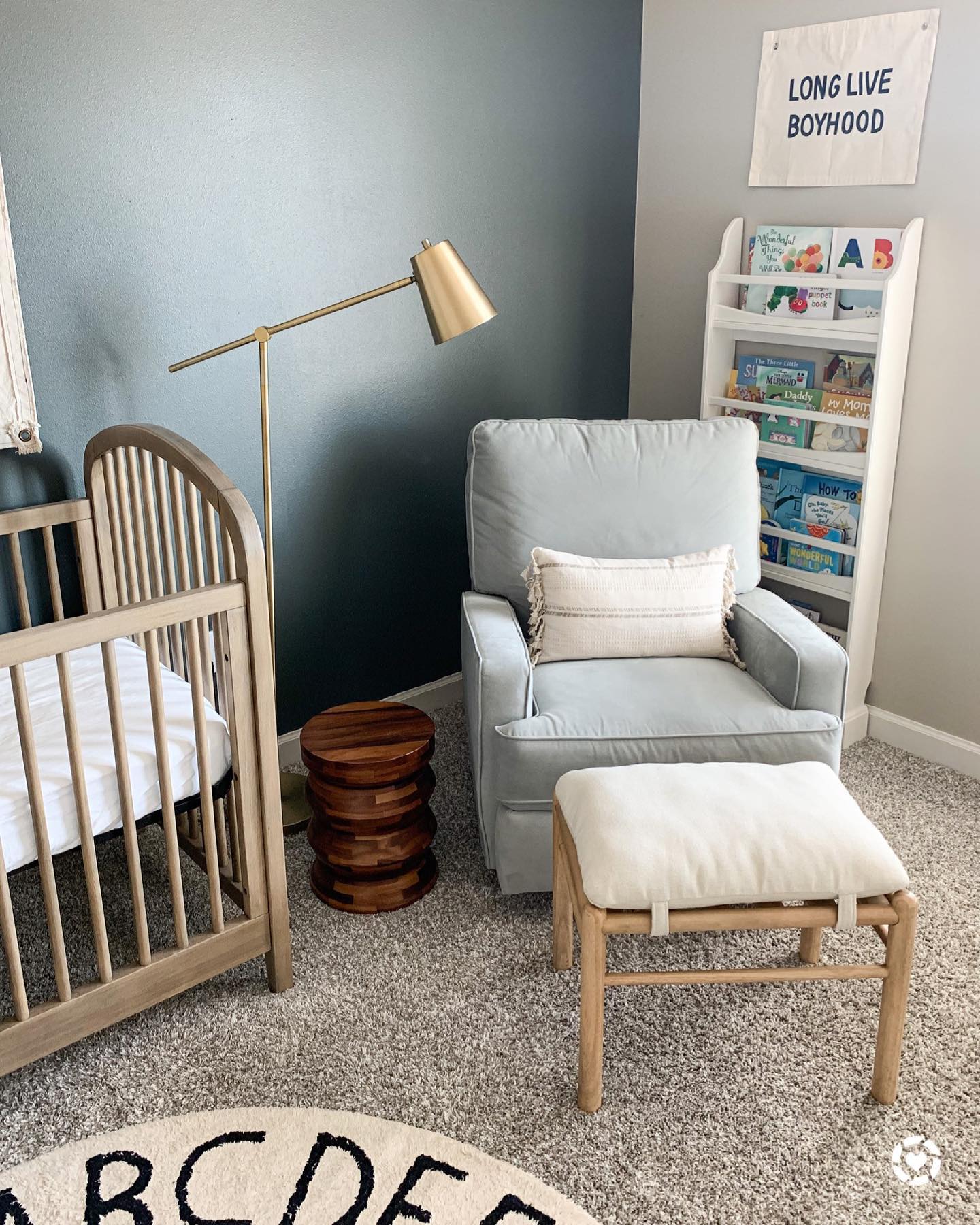 8. Soft Lavender Crib and Geometric Wall Art In a Minimalist Nursery