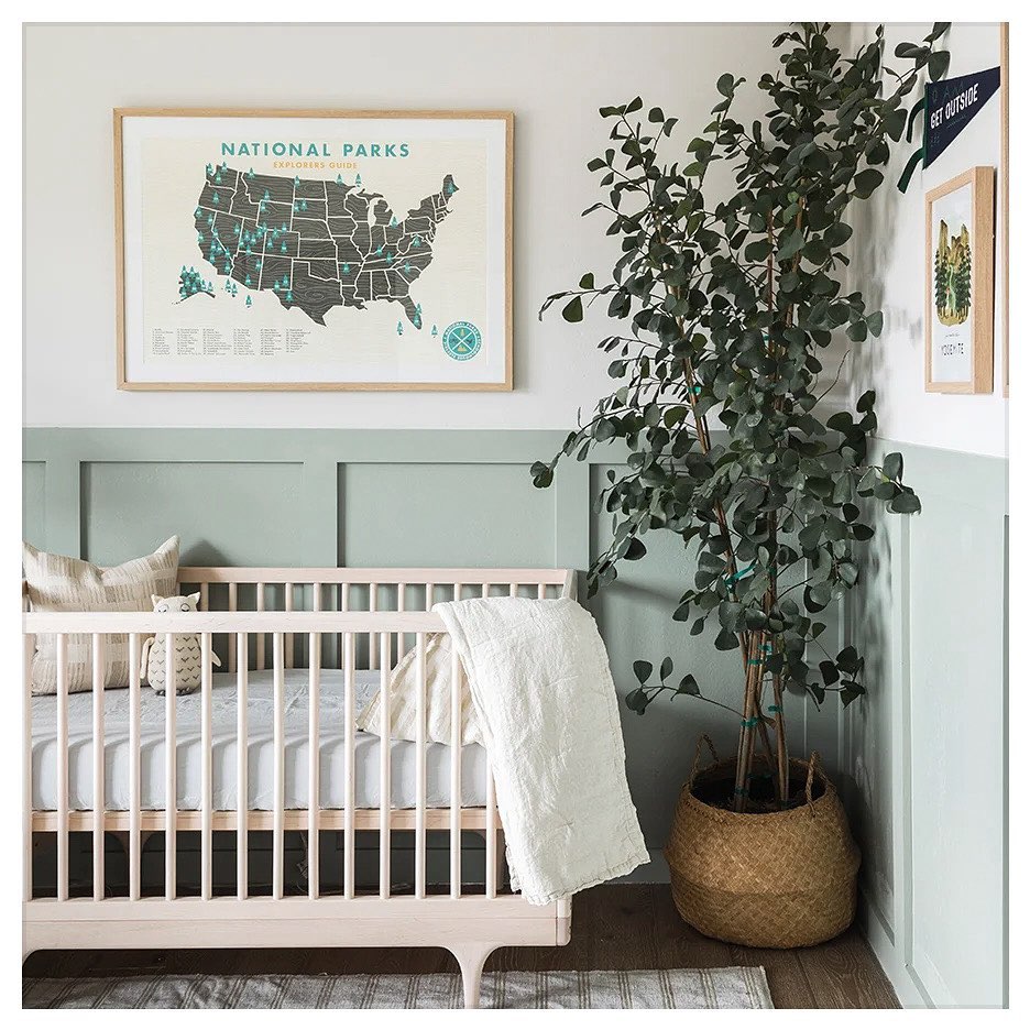 5. Sage Green Crib with Whimsical Cloud Mobile In Cozy Corner