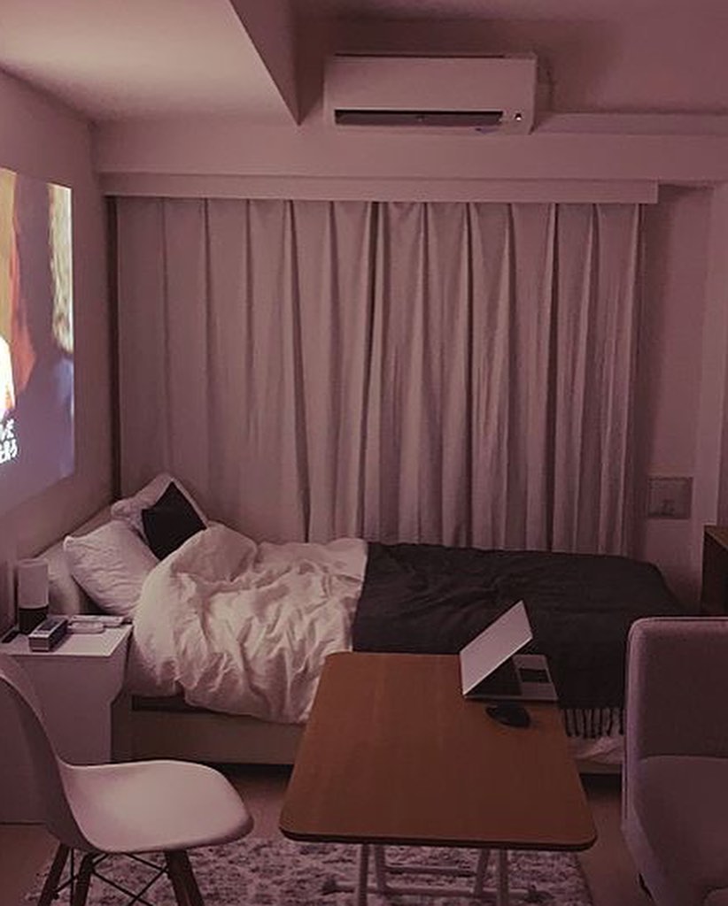 15. Cozy Nook with a Geometric Quilt and Floating Nightstand for Intimate Evenings
