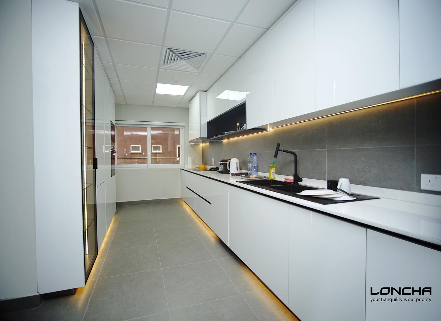 34. Sunlit Herb Garden Kitchen with Geometric Tile Backsplash