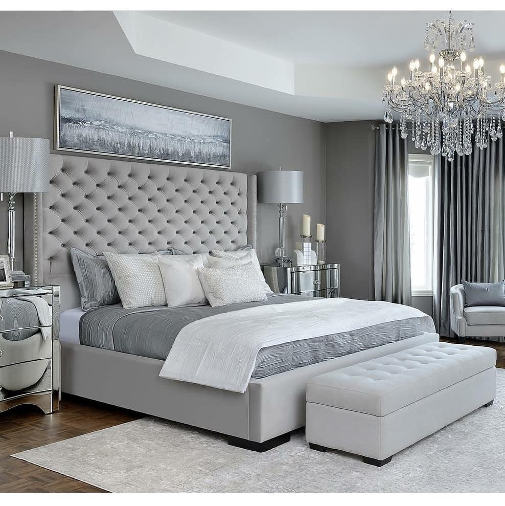 23. Moonlit Serenity: a Grey Bedroom with Cascading Wall Panels and Velvet Elegance