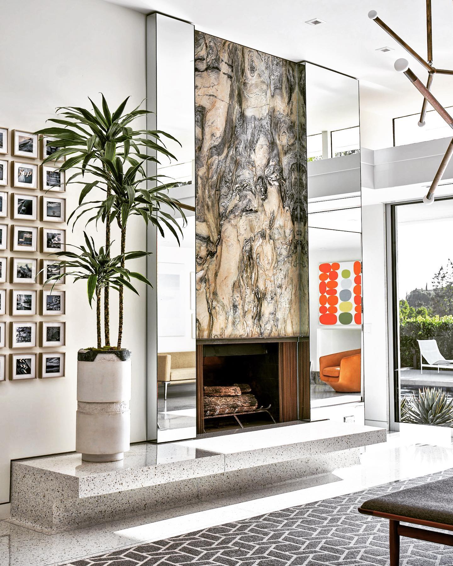 6. Mid-century Mantel with Geometric Vase and Asymmetrical Greenery Display