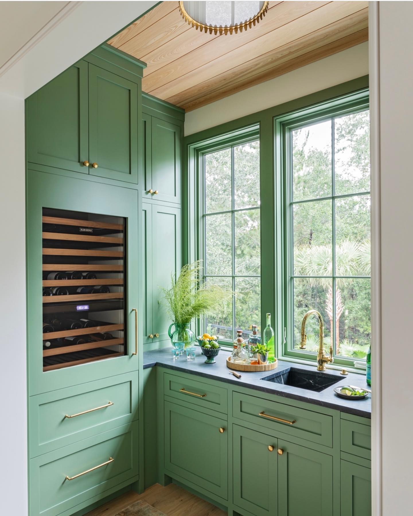 5. Verdant Vines and Copper Accents: a Kitchen Where Nature Meets Metallic Elegance