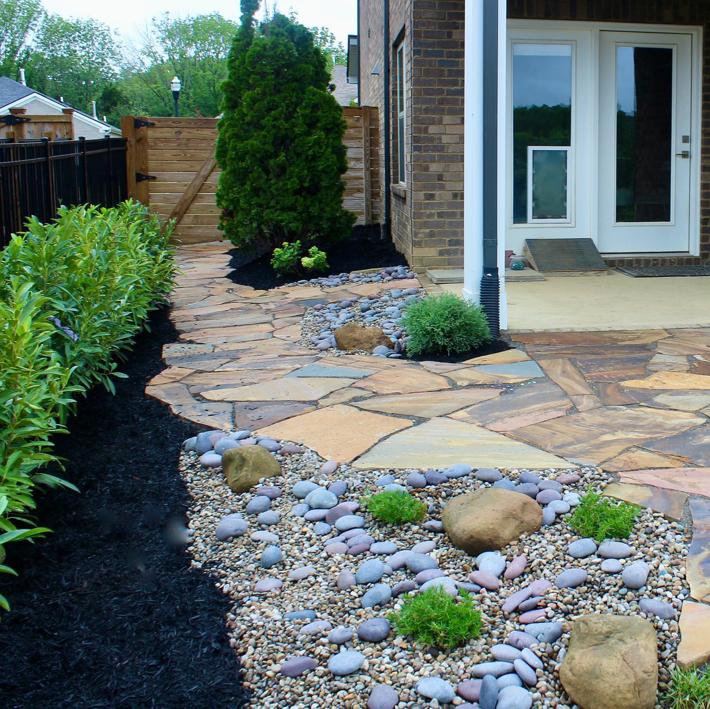 10. Twilight Glow on Cobblestone Curves: a Patio with a Sunset Hue