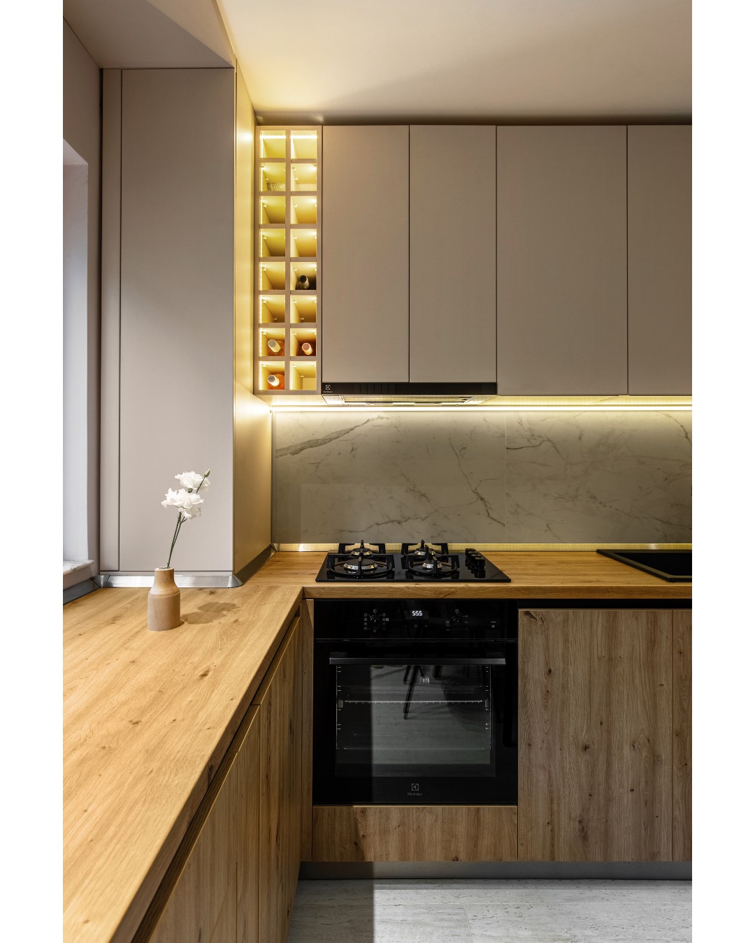 8. the Gleaming Copper Utensil Rack with Vintage Mason Jars Suspended Above a Retro Green Stove