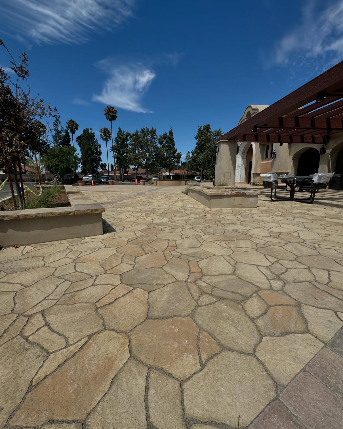 12. Sunken Circular Stone Haven with Arched Pergola Embrace