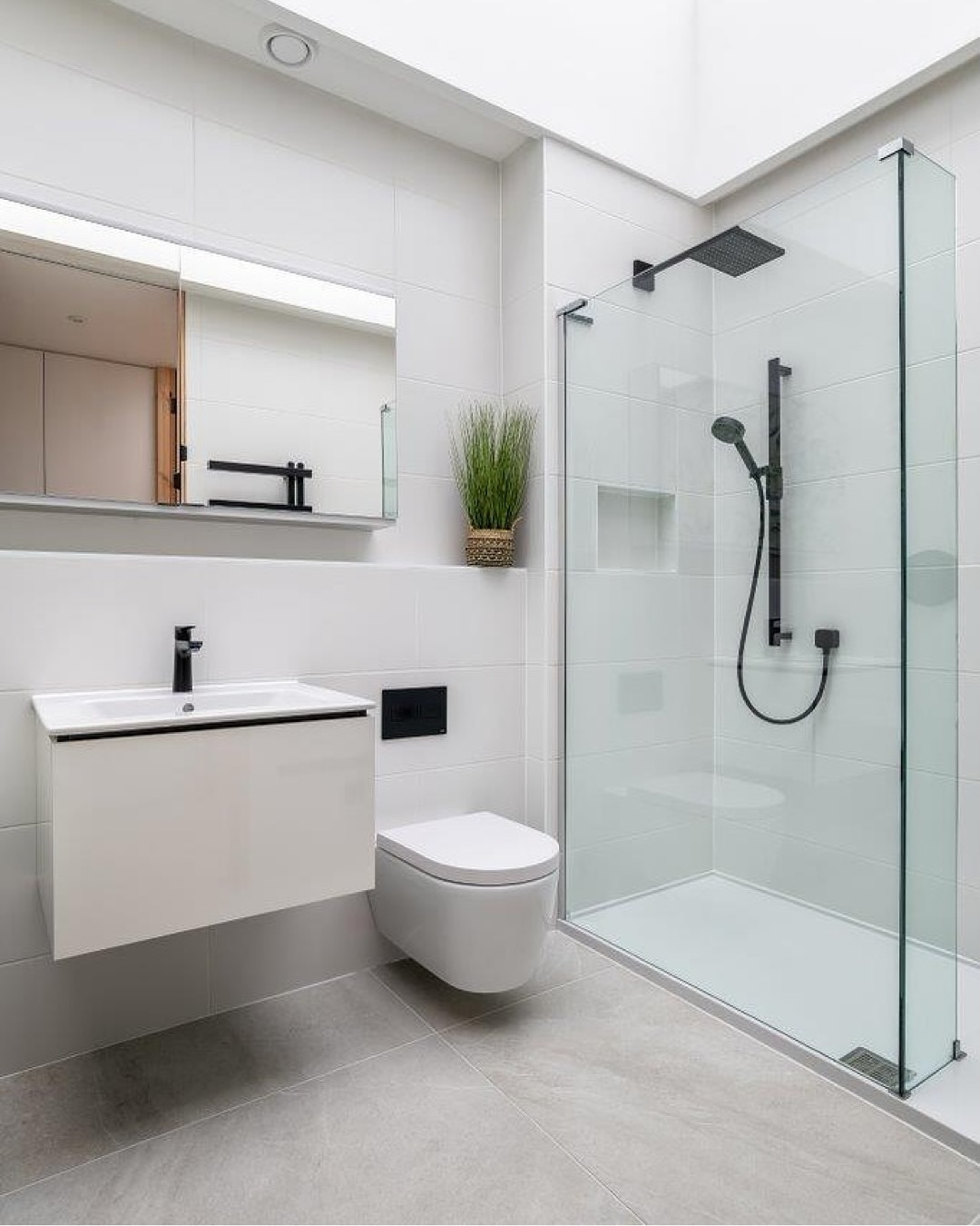 9. Silver Serenity: Moonlit Mosaic Tiles and Floating Vanity In a Dream Bathroom