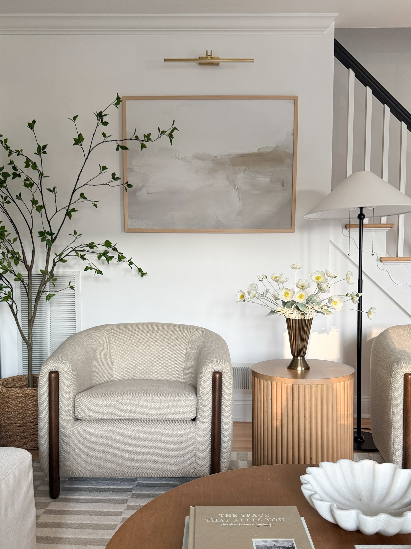 50. Woven Basket-weave Sofa and Monochrome Geometric Rug Fusion