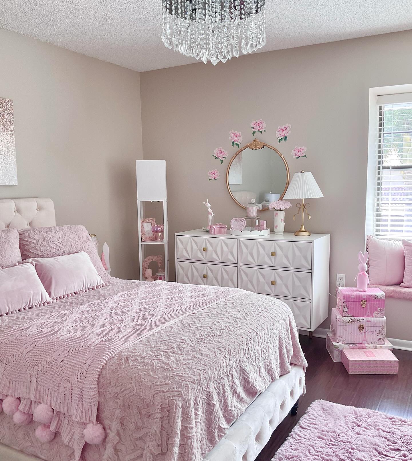 11. Soft Pink Canopy Bed with Vintage Floral Accents and a Playful Teddy Bear