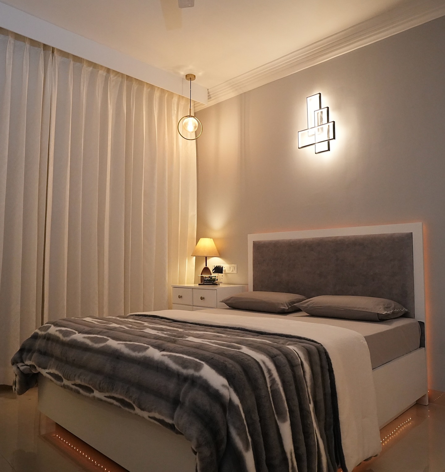 9. Moonlit Serenity: a Canopy Bed with Sheer White Drapes and a Single Hanging Plant