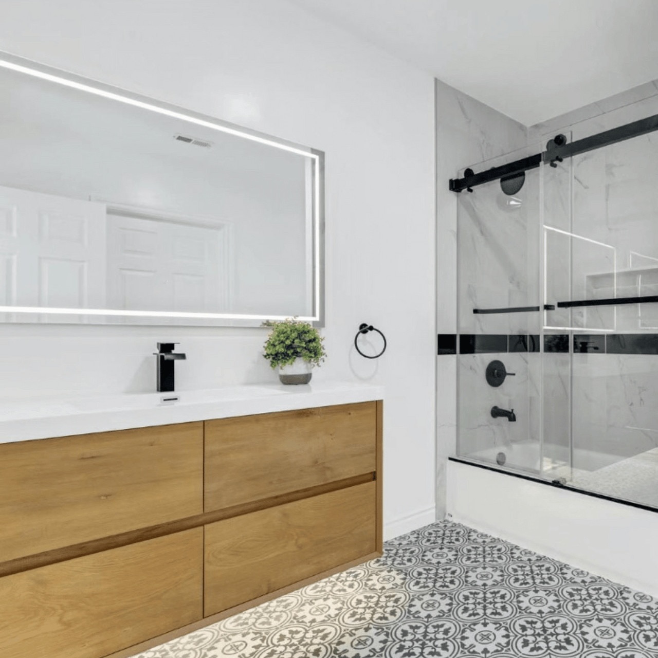 10. Moonlit Marble Mosaic: a Bathroom Vanity with Crescent-shaped Sink and Geometric Tile Accents