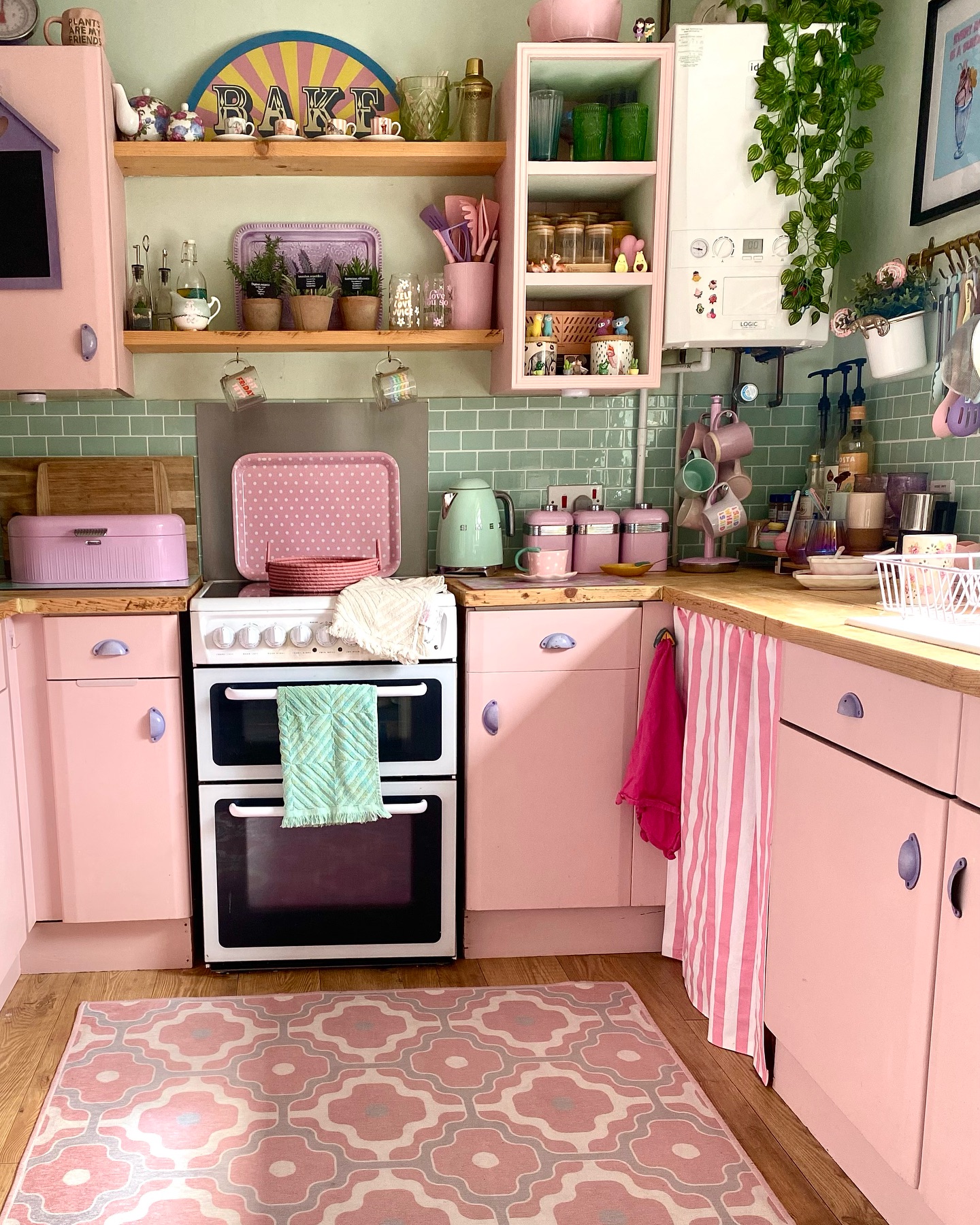 34. Pink Pansy Petal Backsplash with Mint Green Cabinets In a Cozy Breakfast Nook