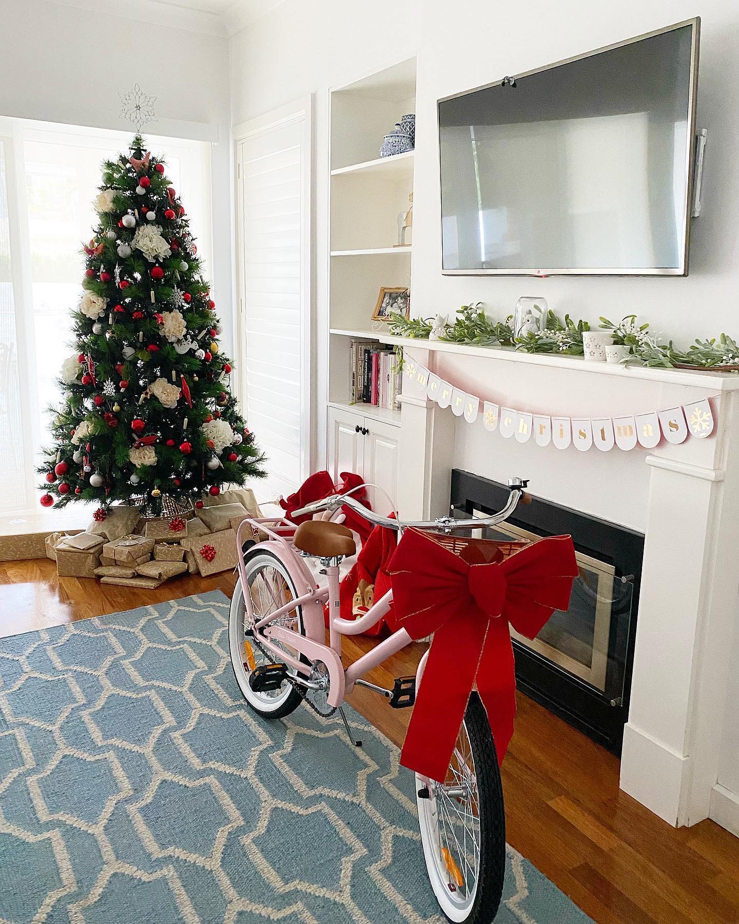 2. a Cardinal's Perch: Crimson Ribbon and White Pinecones on a Frosted Mantel