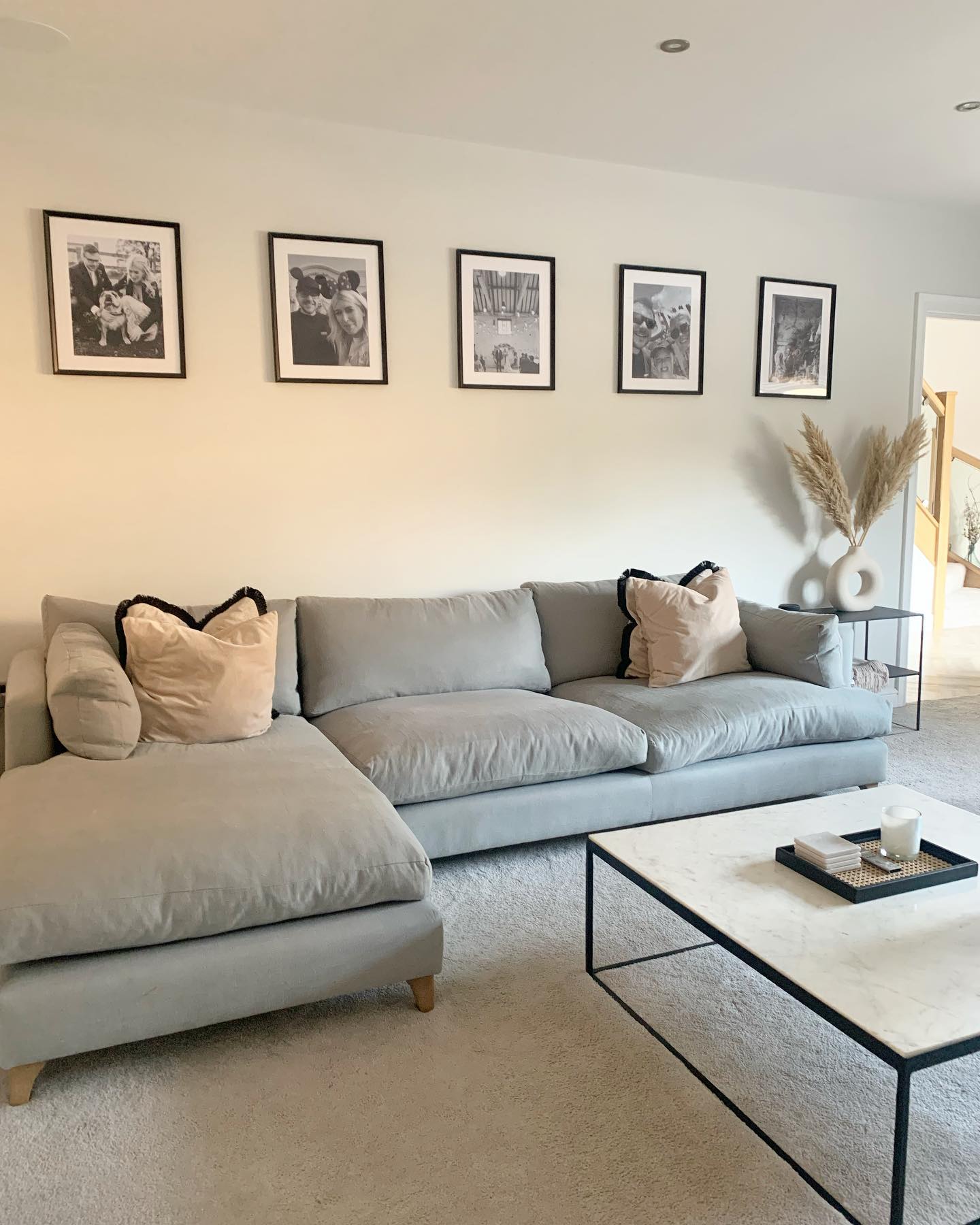 34. a Velvet Olive Green Sofa Embraced by Geometric White Bookshelves