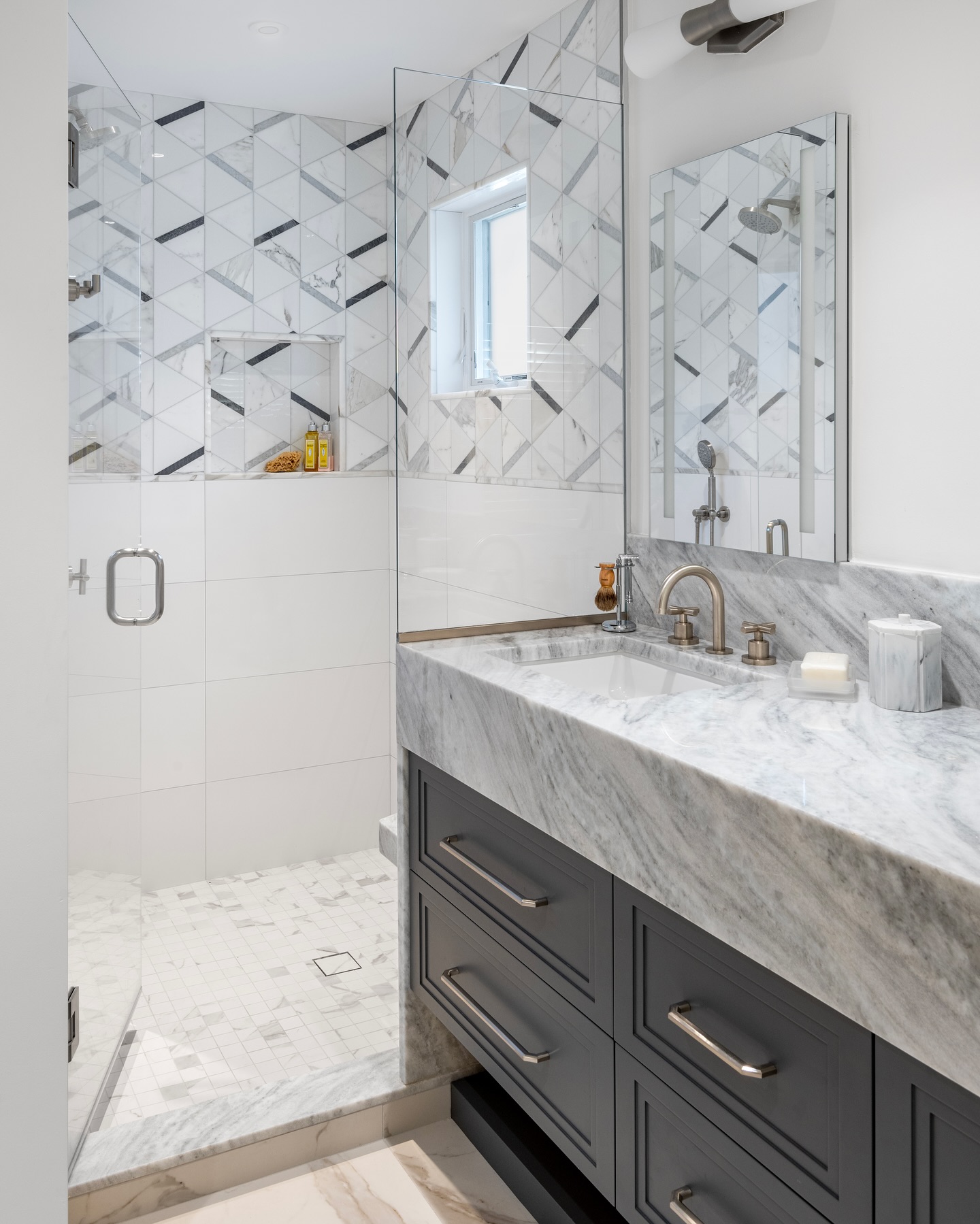 4. Moonlit Marble Mosaic: a Vanity with Crescent-shaped Sink and Glowing Orb Lights