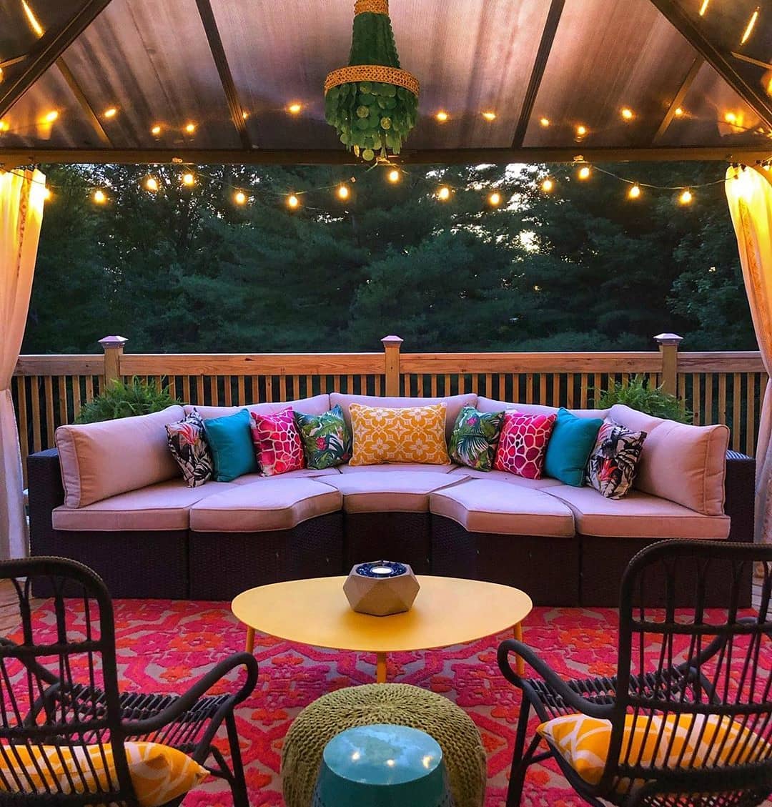 10. the Fusion Of Rustic Charm and Modern Comfort with a Fire Pit and String Lights