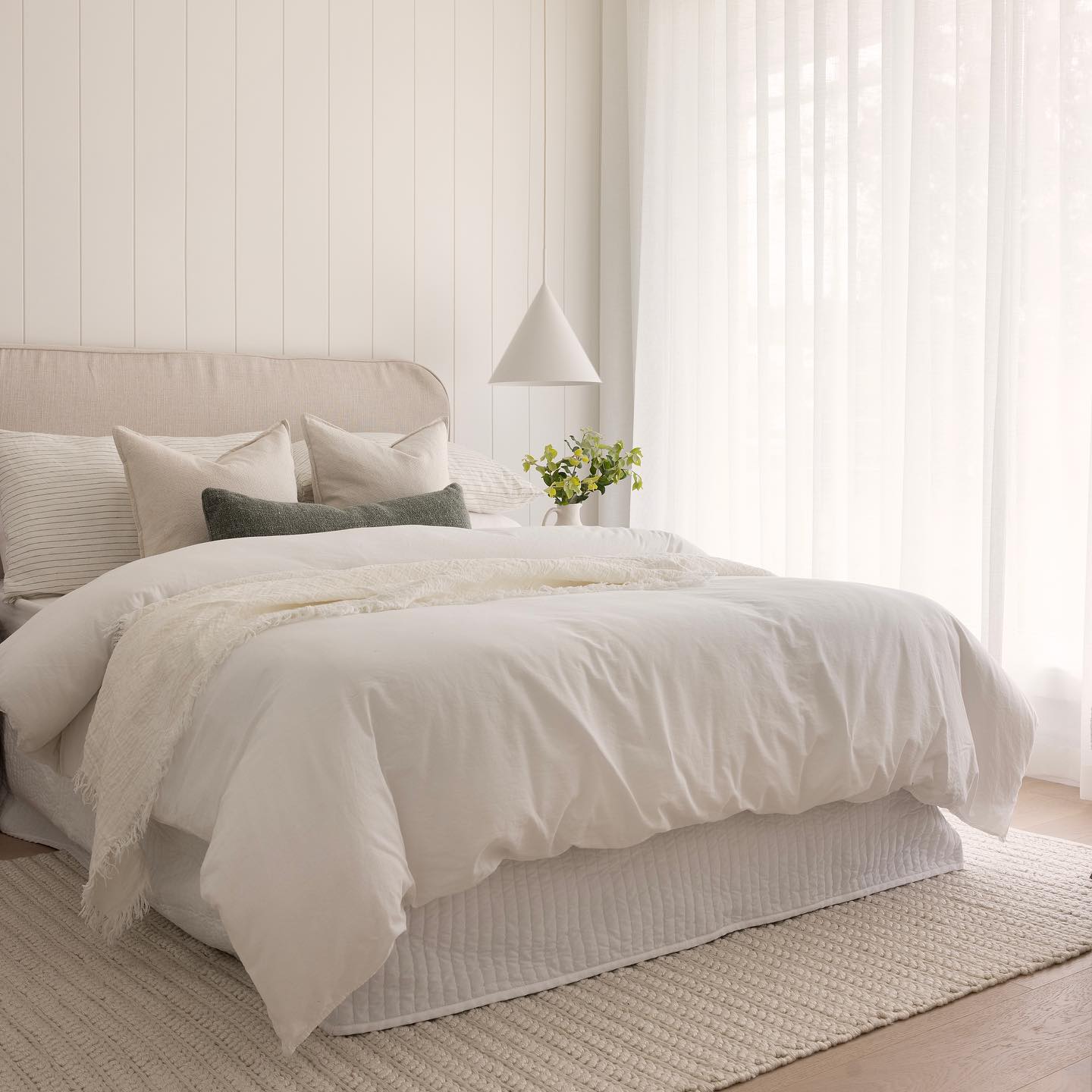 9. Coastal Bedroom with a Weathered Driftwood Canopy Bed and Indigo Textile Accents