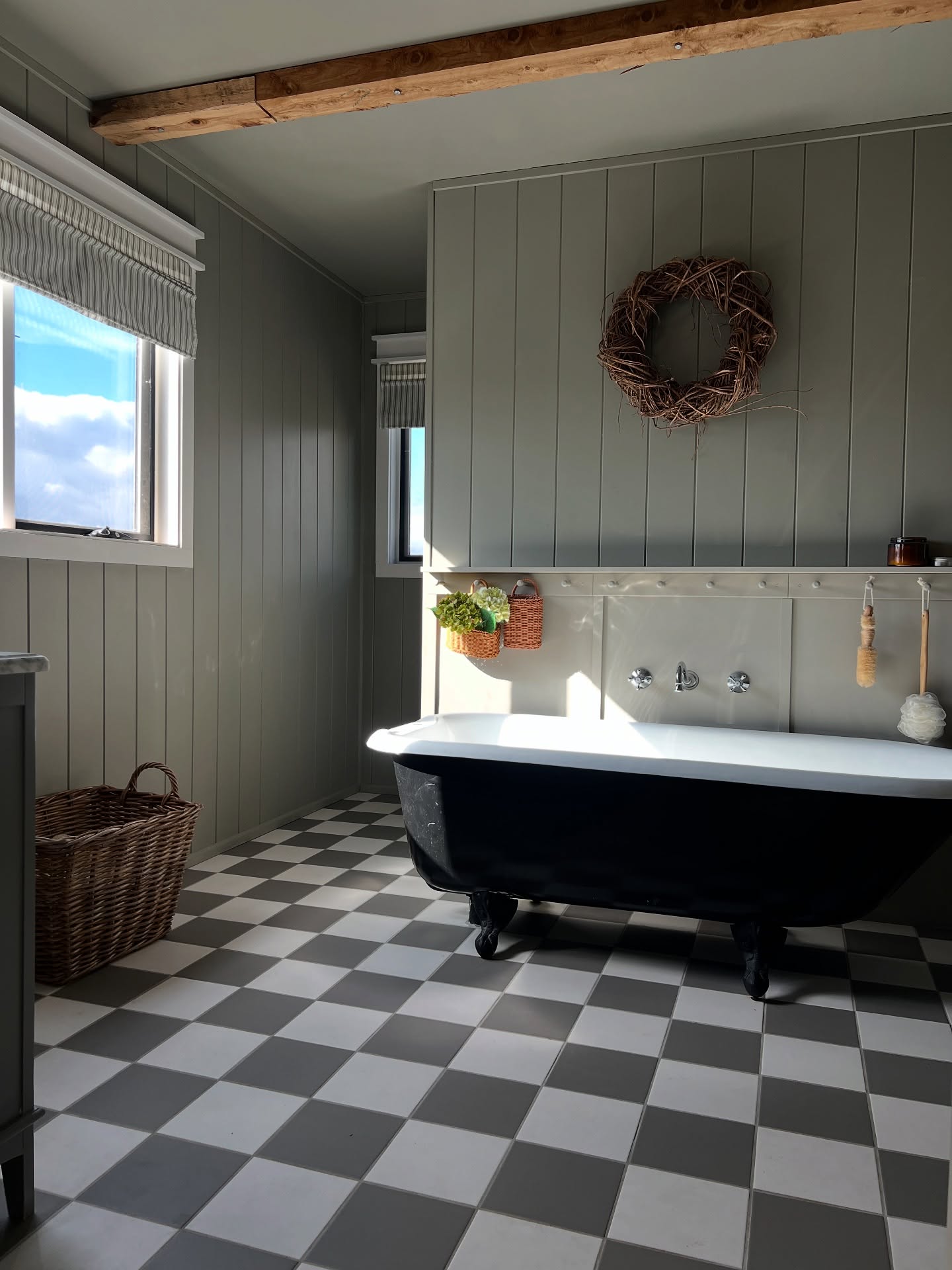 14. Vintage Brass Fixtures Meet Modern Minimalism In a Sunlit Farmhouse Bathroom