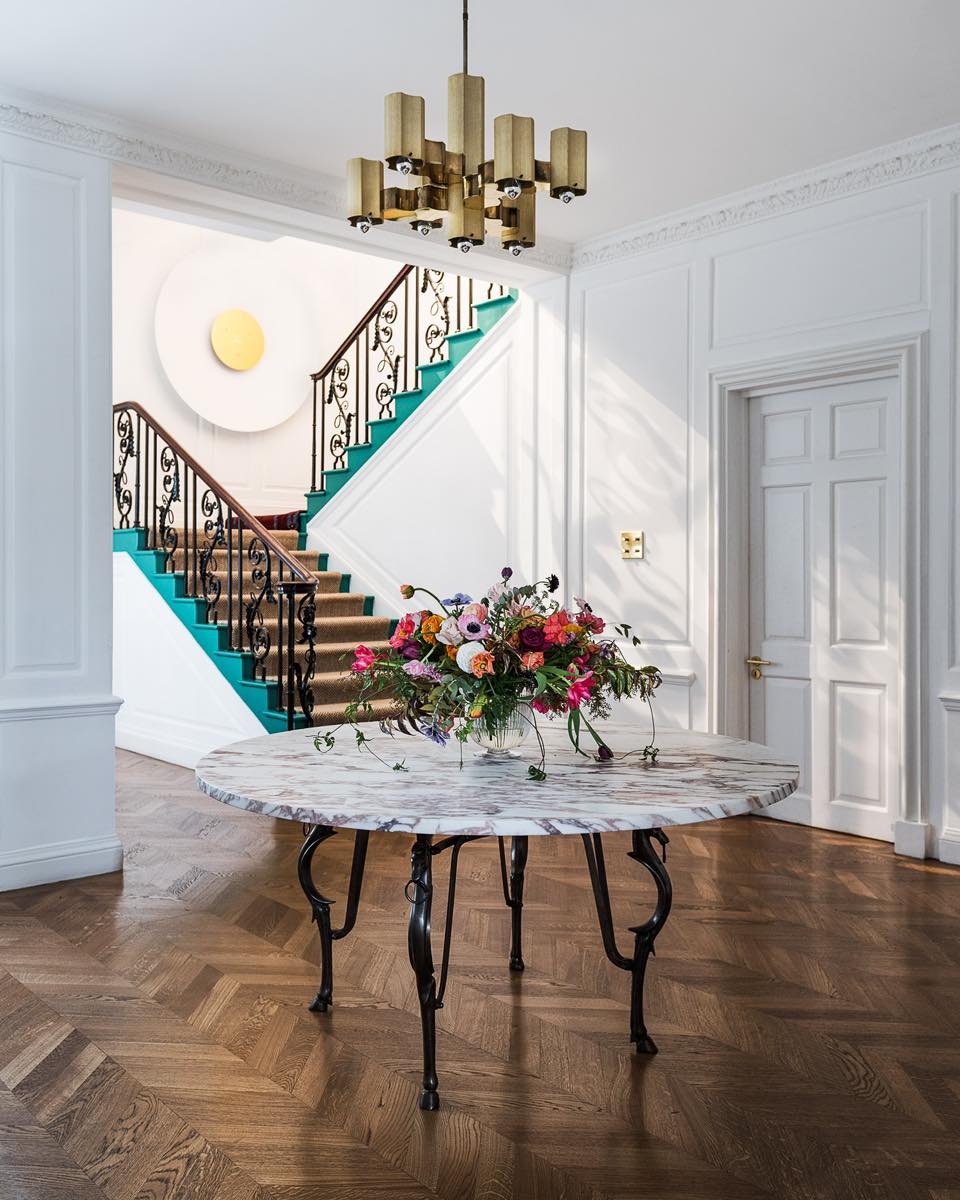 33. the Velvet Curtain and Gold Accent Entrance with Spiral Staircase