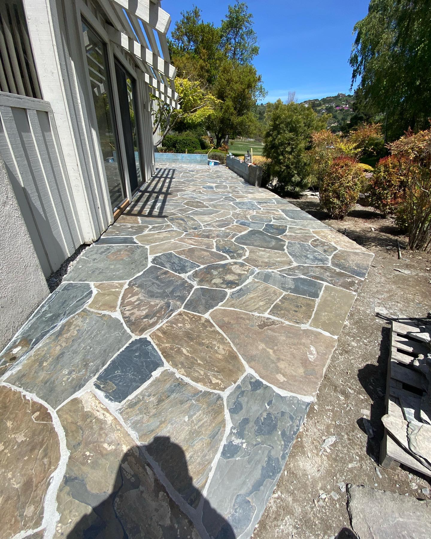 16. the Interlocking Mosaic Of Terracotta and Stone with a Singular Blue Accent