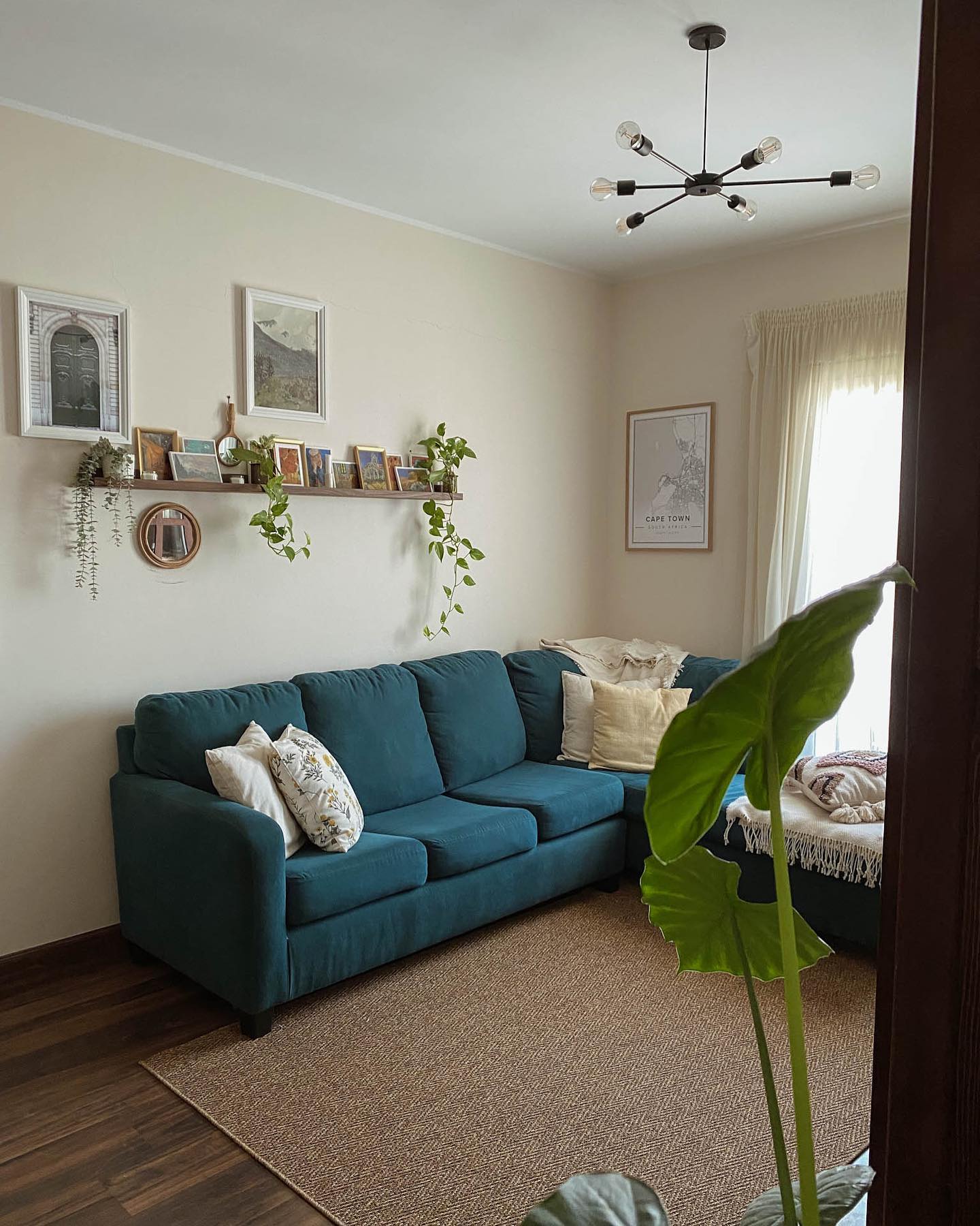 23. a Driftwood Mobile with Hanging Seashells and Starfish Above a Rustic Wooden Mantel