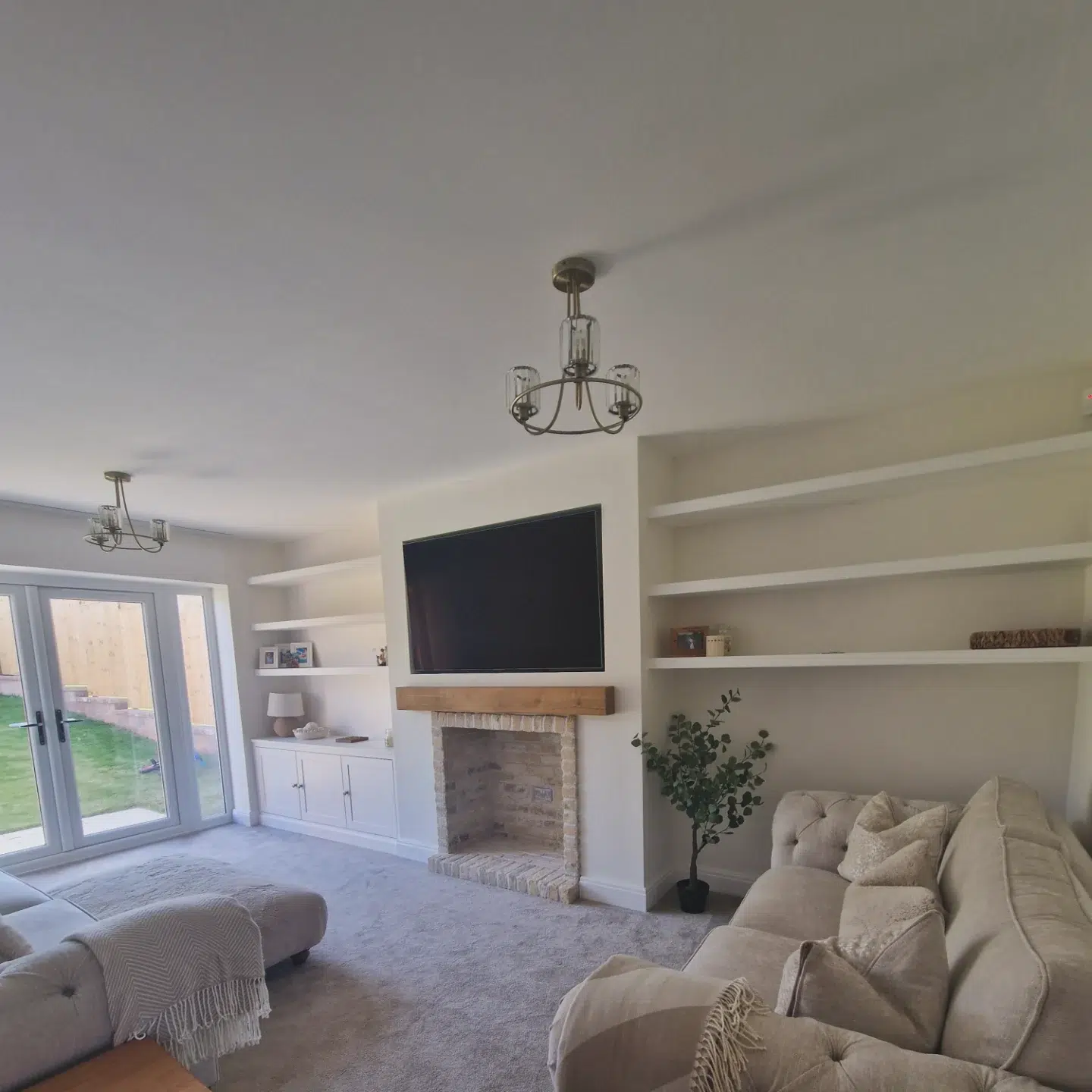 7. Built-in Shelves with Geometric Bookcase and Artisanal Vase Display