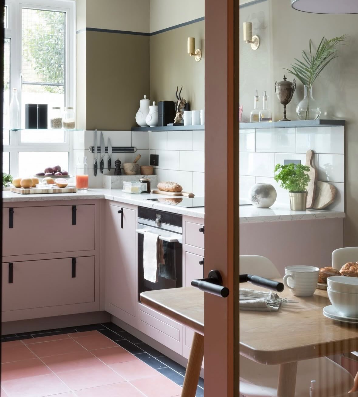 35. Pink Polka-dot Backsplash Meets Retro Mint Stools In Eclectic Kitchen