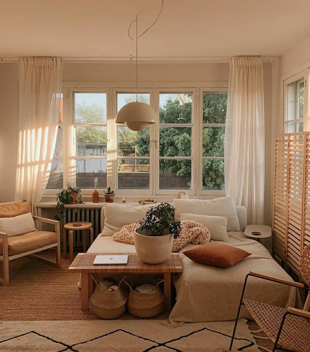 8. a Sunlit Alcove with a Teal Armchair and Geometric Wall Art