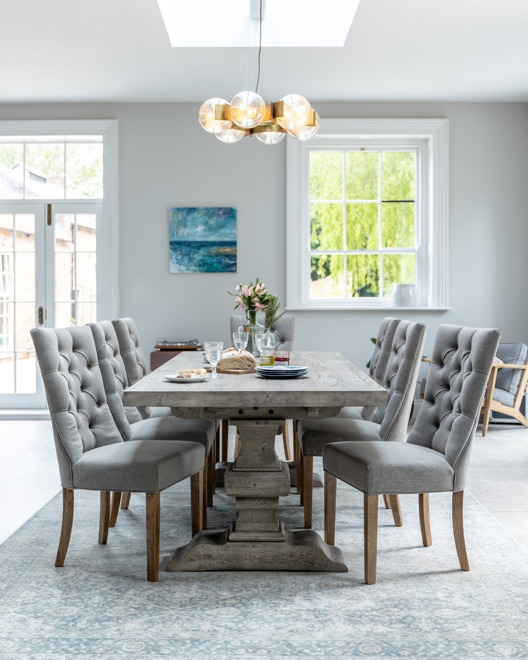 24. Mid-century Modern Dining Table with Slatted Top and Tapered Legs In a Sunlit Room