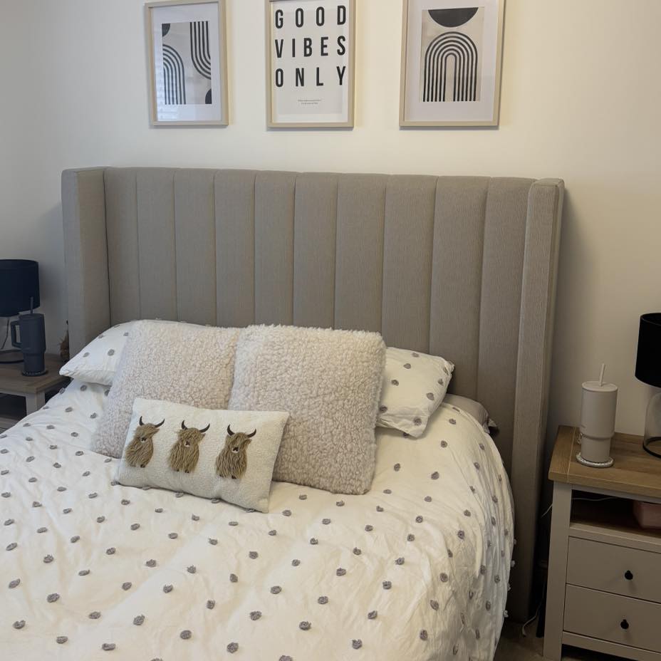 23. Subtle Waves Of Taupe and Linen: a Bedside Table with a Curved Drawer Handle