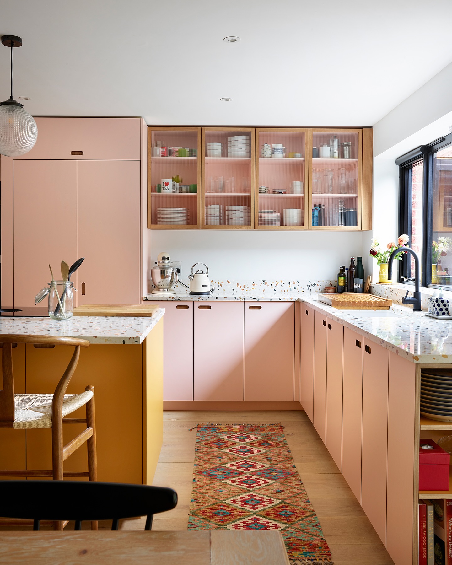 32. Fuchsia Fantasy: Checkerboard Backsplash Meets Retro Appliances