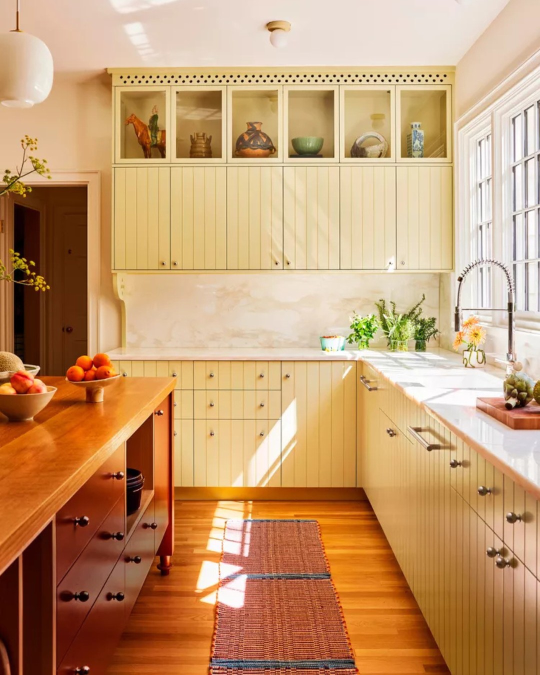 6. Moonlit Midnight Cabinets with Geometric Glass Accents