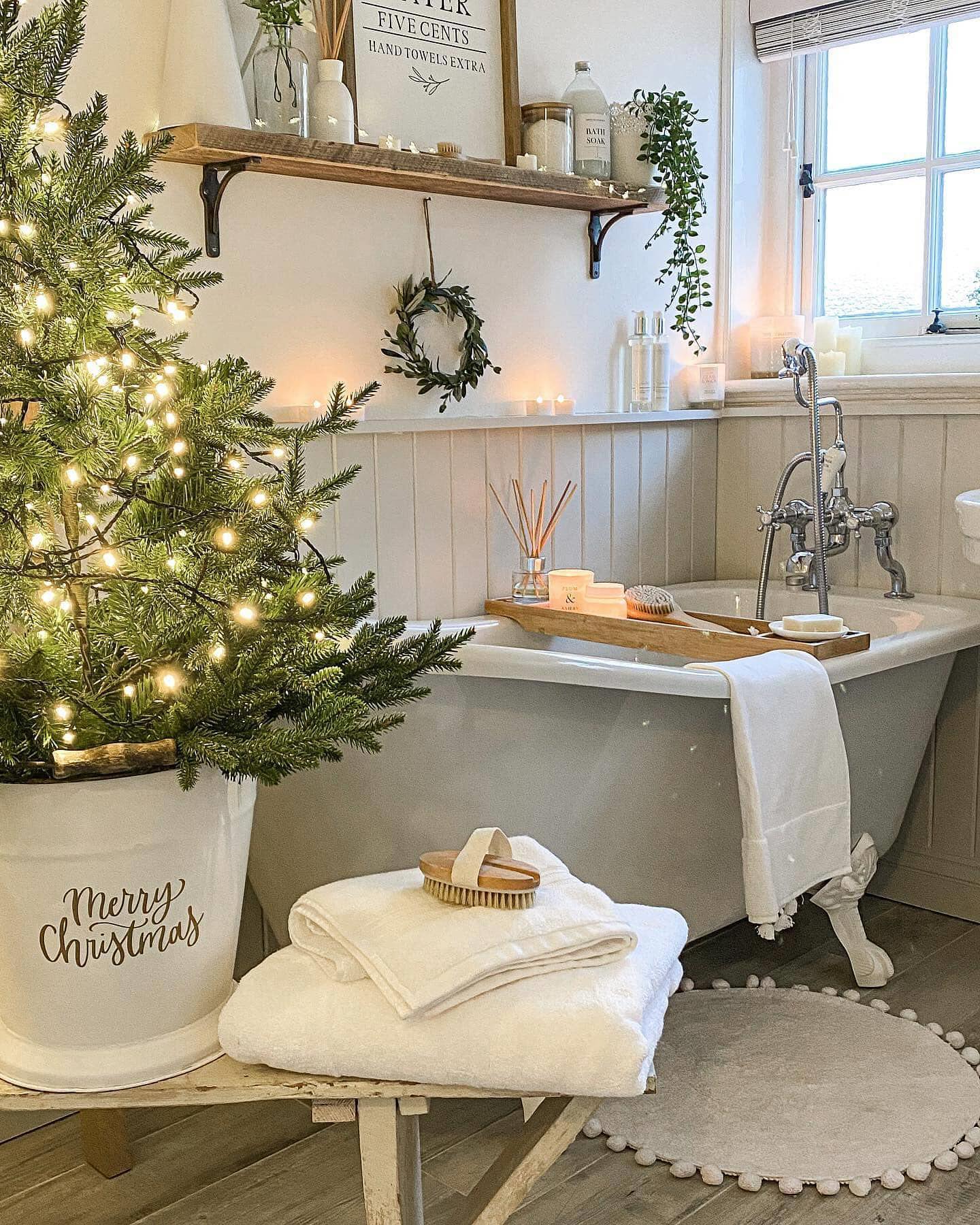 24. Festive Frosty Elegance: White Towels with Scarlet Ribbons on a Vintage Gold Rack