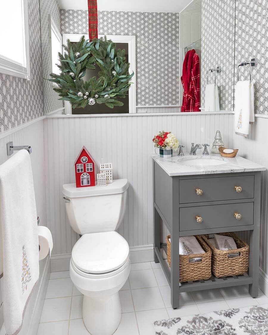 20. Festive Red and White Towel Garland with Miniature Ornaments on a Rustic Wooden Shelf